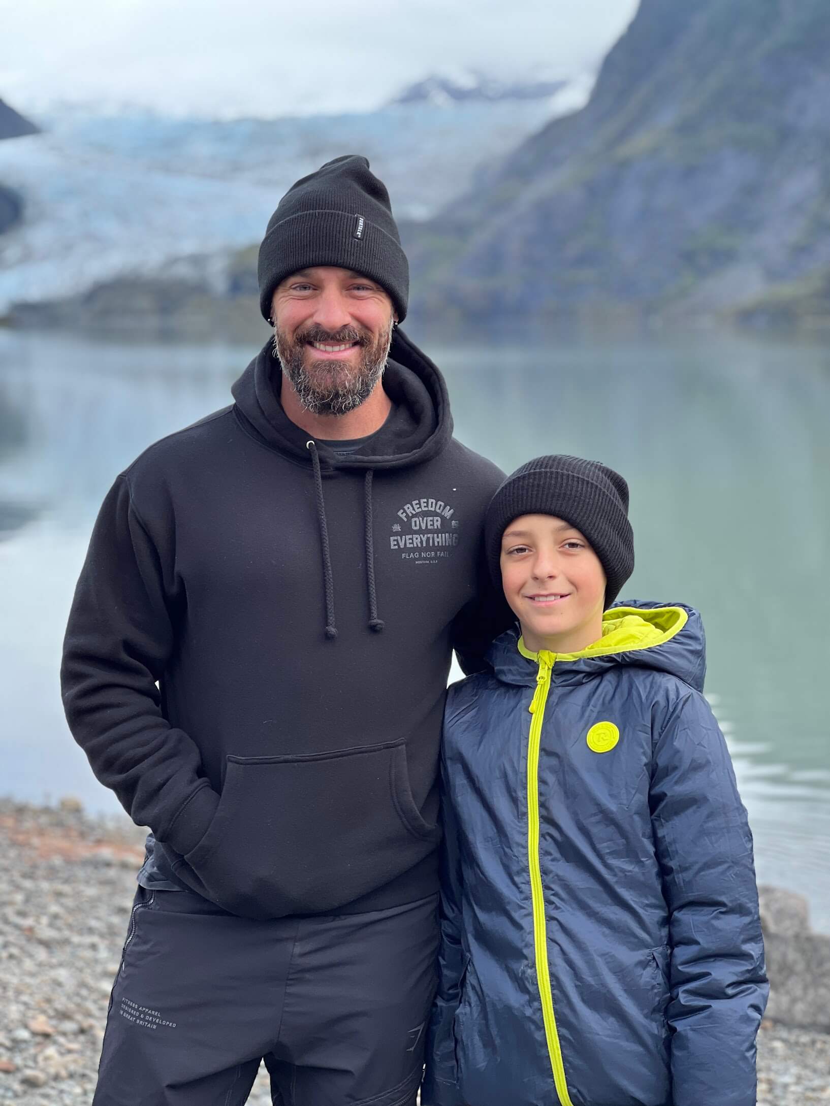 Todd Austin with his son at a glacier lake